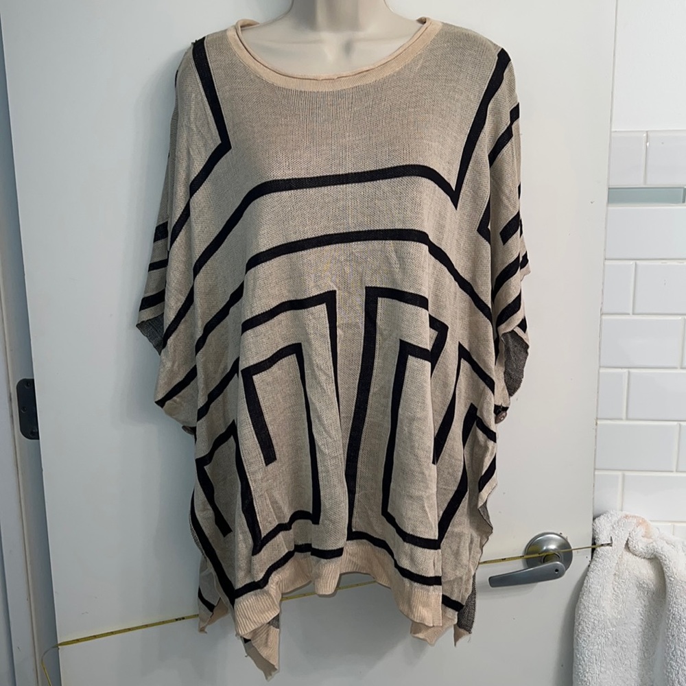 OS prob best 12-14 fit at high end.  Poncho viscose sweater pullover